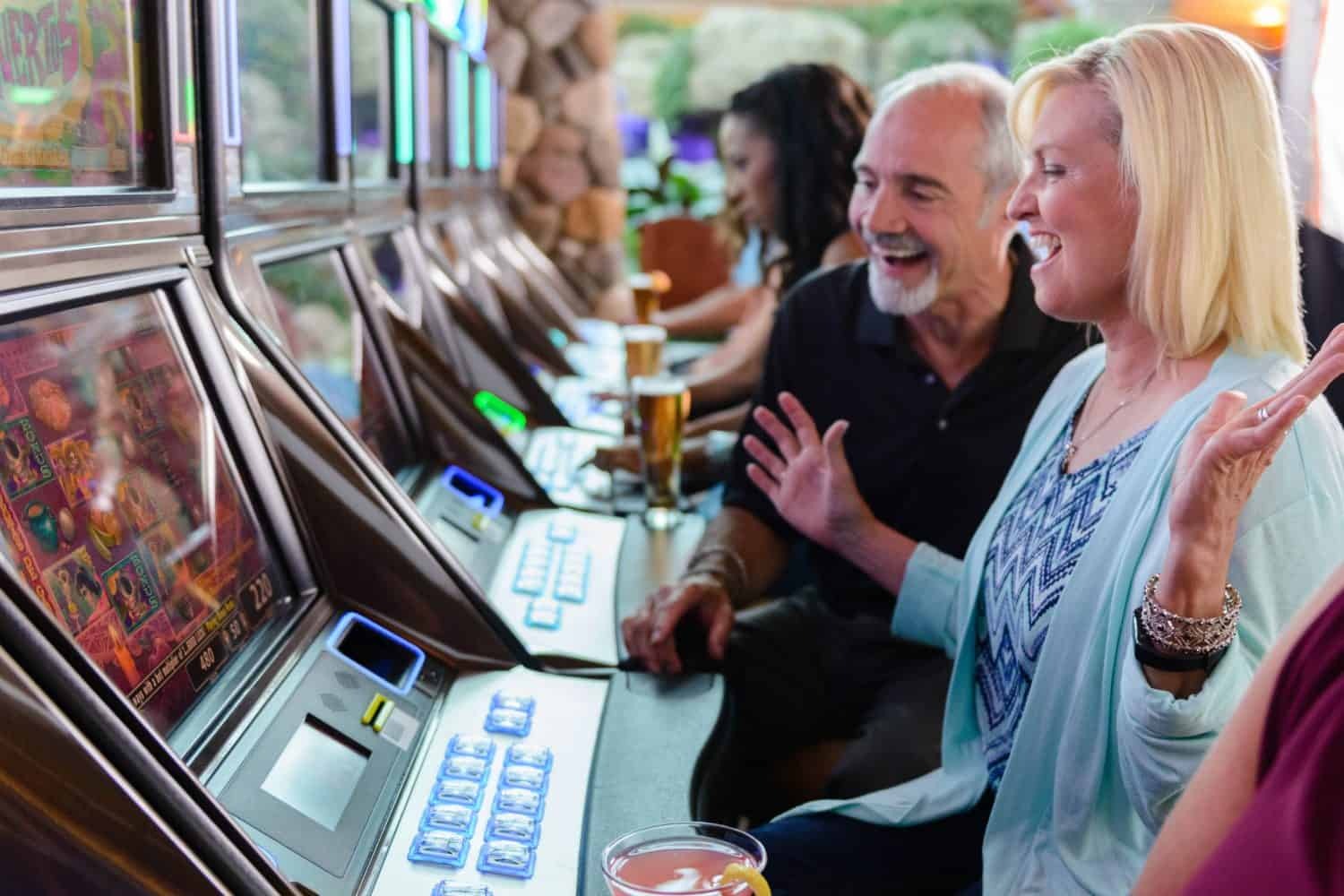 Little-River-Casino-Senior-Couple-Winning-at-Slot-Machine-1500x1000.jpg